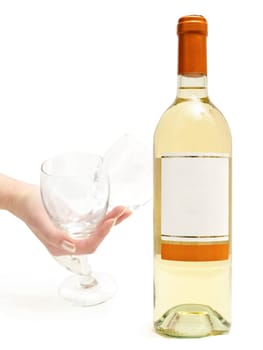  bottle of the white wine with wineglass in hand against the white background