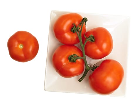 red tomatoes in plate against the white background