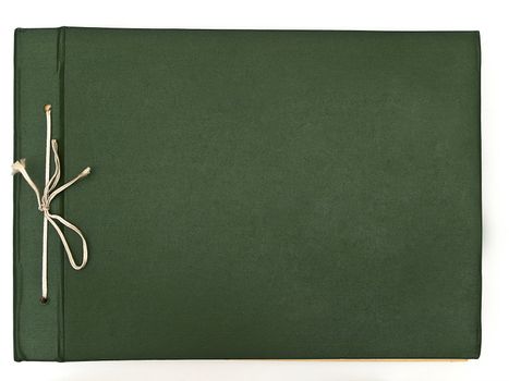 Old fashioned green album against the white background