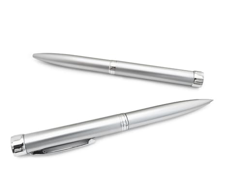 ballpoint pens over the white background