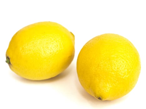 Photo of the two yellow lemons against the white background