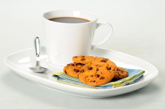 Chocolate chip cookies and a hot cup of coffee.