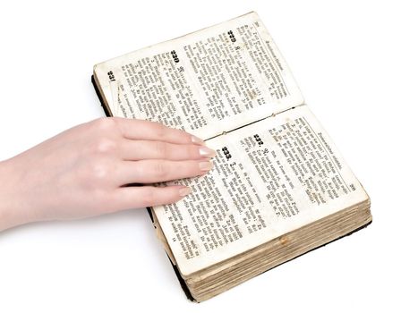 woman hand on old book against the white background