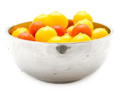 metal bowl with small yellow and red tomatos