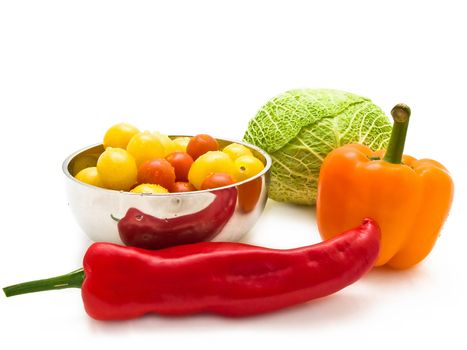 different multicolored vegetables over the white background