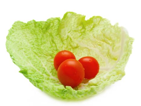 tree small tomatoes in the cabbage leaf