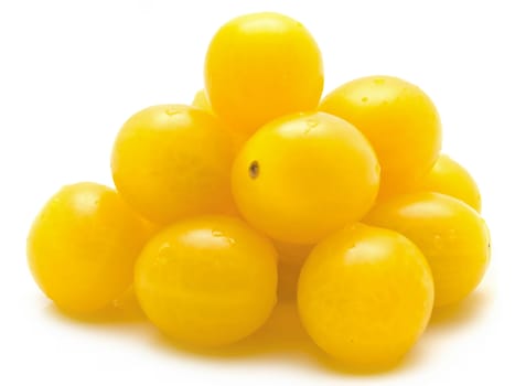 small yellow tomatoes over the white background