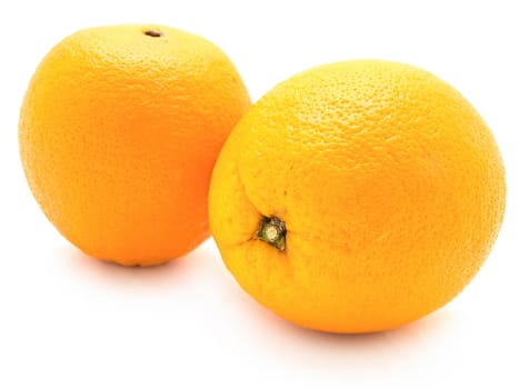 two yellow oranges over the white background