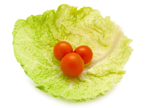 tree small tomatoes in the cabbage leaf
