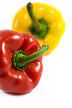red and yellow pepper isolated on white