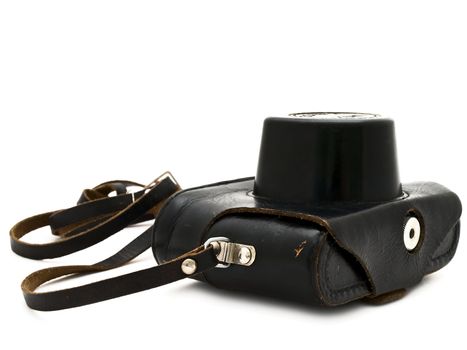 photographic camera in the black leather case