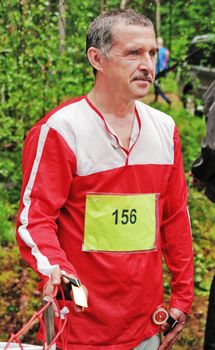 Portrait of the sportsman on start of orienteering  competitions