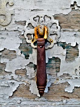 Vintage door knocker with old paint