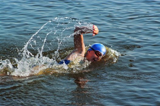 The sportswoman swim in water at competitions