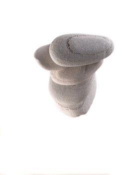 Balanced beach stones from top isolated on white