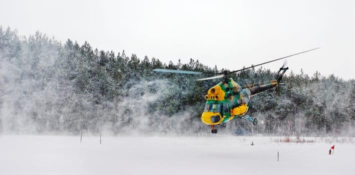 flying up helicopter in a snow dust