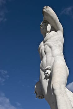 statue of an athlete on a sunny day