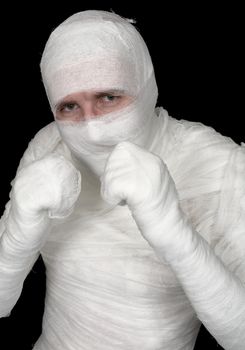 Man in bandage on the black background