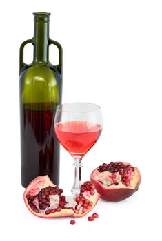 Still-life with a glass of wine, bottle and a red pomegranate