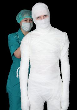 Man in bandage and nurse on black background	