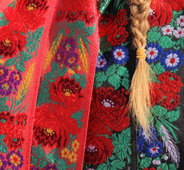 Detail of folk costume and hair.