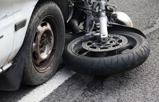 Car collided with a motorbike.