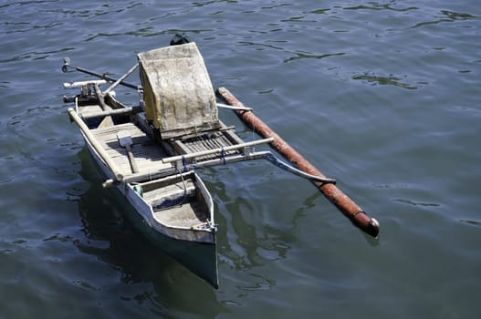 Rusty old fishing boat in Indonesian harbor