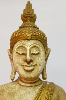 Buddha staue on wood 