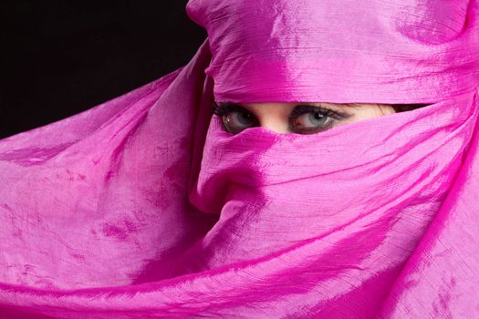 Arabian woman wearing pink headscarf