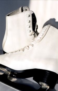 Pair of white ice skates for figure-skating