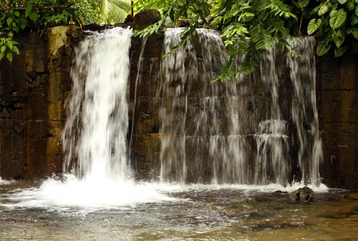 Beautiful waterfall in wild forest, long exposure 