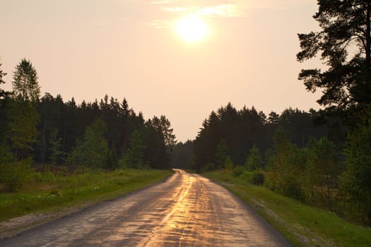 asphalt country road on sunrise