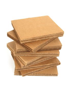 Stack of cardboard with copy space, isolated on white.