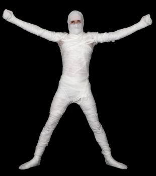 Bandaged young man upright on black background