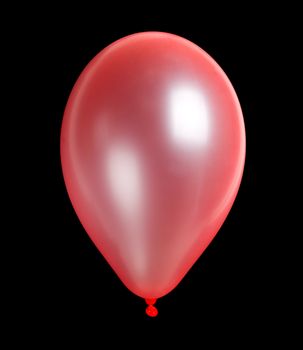 close-up pink balloon, isolated on black