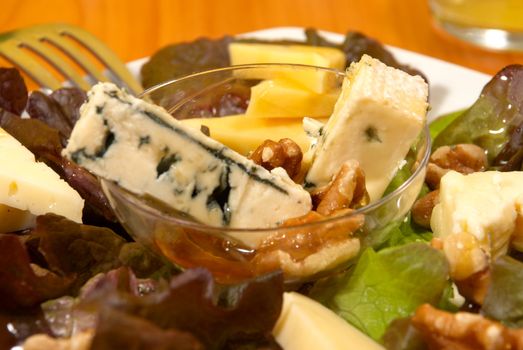 Cheese salad with nuts dressed with honey