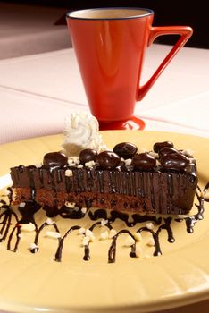 Decorated chocolate cake dessert served with coffee