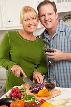 Happy Couple Enjoying An Evening Preparing Food in the Kitchen.