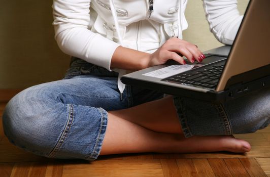 Computer in a lap the young girl