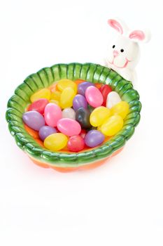 Jelly beans in a bunny candy dish.  Isolated on white with room for copy space.