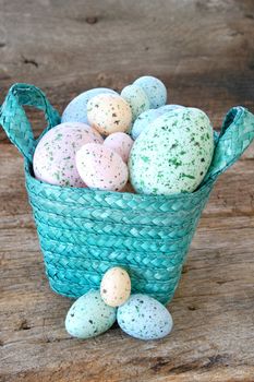 Basket full of eggs on an old piece of wood for a rustic look.