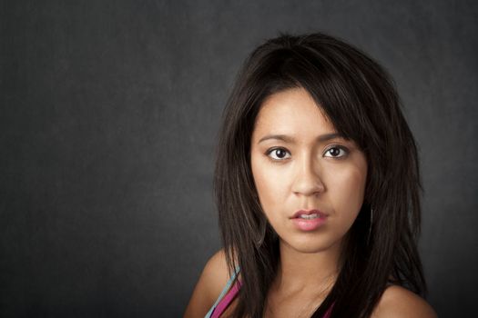 Close up portrait of a pretty brunette woman with copy space