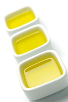 Olive Oil in small serving bowls isolated against a white background