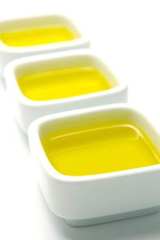 Olive Oil in small serving bowls isolated against a white background