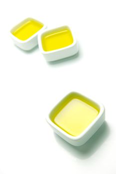 Olive Oil in small serving bowls isolated against a white background