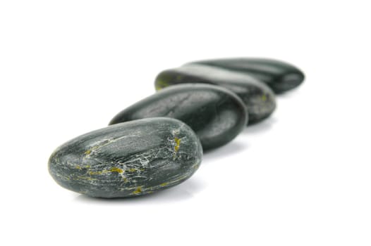 Black river rocks isolated against a white background