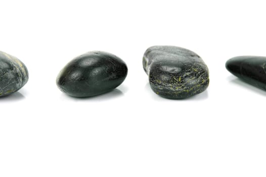 Black river rocks isolated against a white background