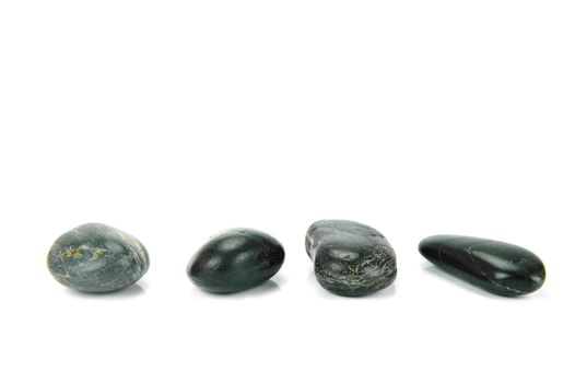 Black river rocks isolated against a white background