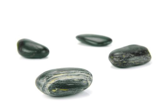 Black river rocks isolated against a white background