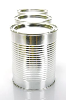 Tin cannisters isolated against a white background